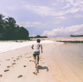 A demo photo of DET "Write about the Photo" questions: a man running along the shoreline